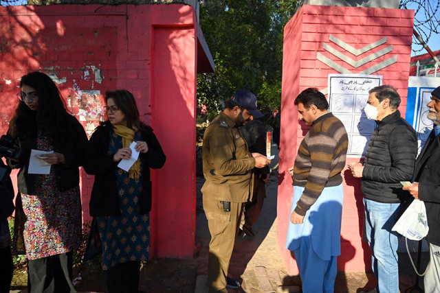a policeman checks identity cards of men as they arrive to cast their ballots to vote during pakistan s national elections at a polling station in lahore on february 8 2024 photo afp a policeman checks identity cards of men as they arrive to cast their ballots to vote during pakistan s national elections at a polling station in lahore on february 8 2024 photo afp