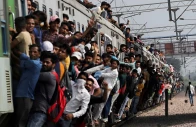 people cling on to a crowded train as it leaves a railway station during the ongoing coronavirus disease covid 19 outbreak in ghaziabad india september 21 2021 reuters people cling on to a crowded train as it leaves a railway station during the ongoing coronavirus disease covid 19 outbreak in ghaziabad india september 21 2021 reuters
