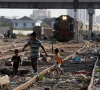 siblings walk along a railway tracks at a slum area in karachi on pakistan july 9 2020 photo reuters