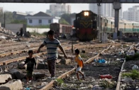 siblings walk along a railway tracks at a slum area in karachi on pakistan july 9 2020 photo reuters