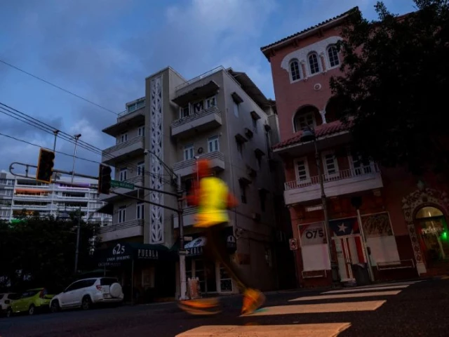 a man jogs on a dark street in san juan puerto rico after a major power outage hit the island tuesday photo afp a man jogs on a dark street in san juan puerto rico after a major power outage hit the island tuesday photo afp