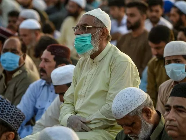 a muslim devotee wearing a facemask offers prayers during the eid ul azha photo afp a muslim devotee wearing a facemask offers prayers during the eid ul azha photo afp