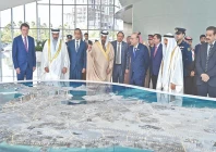 president asif ali zardari gets a briefing by an official of the economic development board in manama photo inp