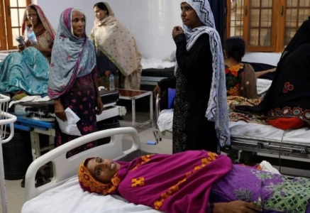 a pregnant woman lies on a hospital bed source reuters