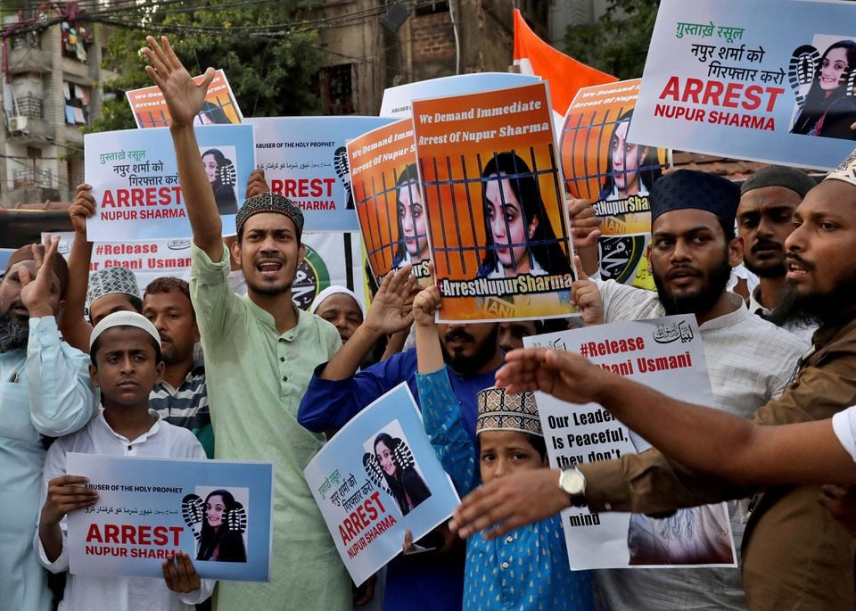 people shout slogans as they hold placards during a protest demanding the arrest of bharatiya janata party bjp member nupur sharma for her blasphemous comments on prophet mohammed pbuh in kolkata india june 7 2022 photo reuters