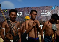 members of the indigenous movement munduruku ipereg ayu hold a protest outside the united nations climate summit venue in belem brazil photo afp