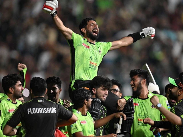 lahore qalandars players lift sikandar raza in celebration after their win over quetta gladiators in the hbl psl x final photo afp