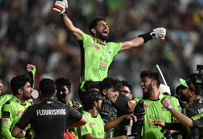 lahore qalandars players lift sikandar raza in celebration after their win over quetta gladiators in the hbl psl x final photo afp