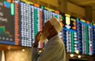 a stock broker reacts while monitoring the market on the electronic board displaying share prices during trading session at the pakistan stock exchange in karachi on july 3 2023 photo reuters file a stock broker reacts while monitoring the market on the electronic board displaying share prices during trading session at the pakistan stock exchange in karachi on july 3 2023 photo reuters file