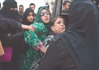 police officers detain pti supporters during a protest in karachi photo jalal qureshi express