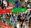 supporters of former prime minister imran khan hold a giant cricket bat with the colours and initials of the party photo afp file