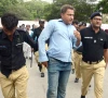 police detain a protesting pti activist during a demonstration marking three years since imran khan s arrest near the karachi press club on wednesday photo express