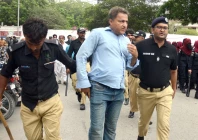 police detain a protesting pti activist during a demonstration marking three years since imran khan s arrest near the karachi press club on wednesday photo express