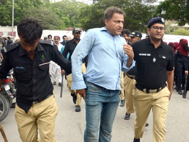 police detain a protesting pti activist during a demonstration marking three years since imran khan s arrest near the karachi press club on wednesday photo express police detain a protesting pti activist during a demonstration marking three years since imran khan s arrest near the karachi press club on wednesday photo express