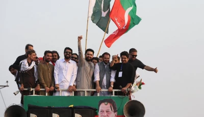 cm afridi raises his fist to supporters during a protest march by pti in bara on the outskirts of peshawar khyber pakhtunkhwa on october 7 2026 photo reuters