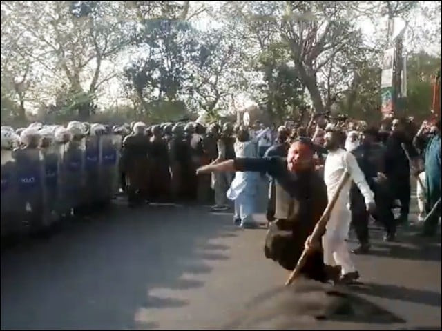pti workers and police personnel clash outside imran khan s zaman park residence in lahore on march 14 2023 screengrab