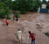 citizen s wade through the flooded area of narowal a city of punjab on august 27 2025 photo afp