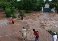 citizen s wade through the flooded area of narowal a city of punjab on august 27 2025 photo afp