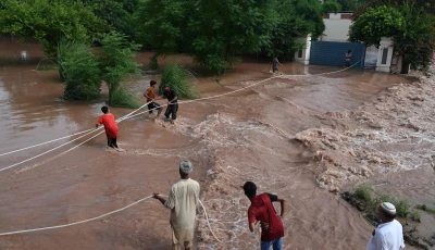 citizen s wade through the flooded area of narowal a city of punjab on august 27 2025 photo afp