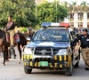 punjab police officials waiting alongside readied vehicles and on horseback photo express file