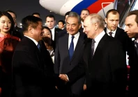 russia s president vladimir putin shakes hands with china s ambassador to russia zhang hanhui as foreign minister wang yi stands nearby during a welcoming ceremony at an airport in beijing china may 19 2026 sputnik via reuters