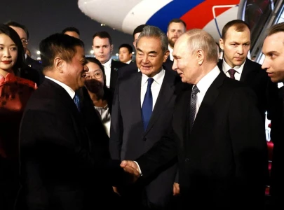 putin lands in china for trip that aims to show unshakeable ties after trump pomp