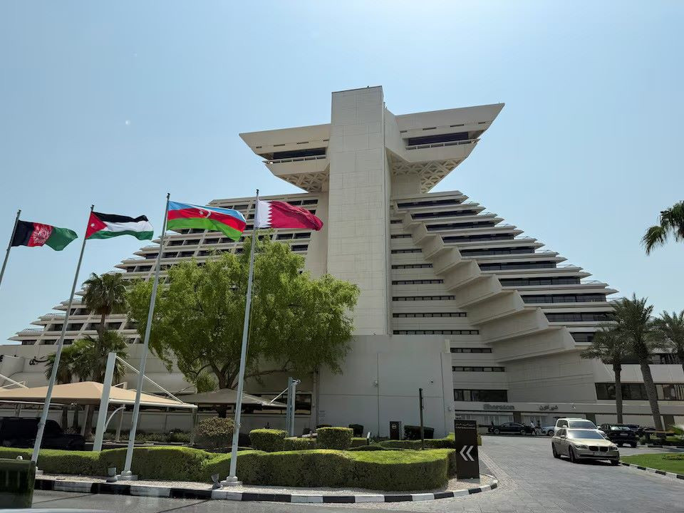 Flags of Afghanistan, Jordan, Azerbaijan and Qatar flutter as Qatar prepares to host the Emergency Arab-Islamic Summit at the Sheraton Hotel, in Doha, Qatar, September 14, 2025. REUTERS/