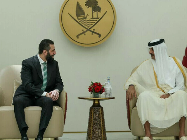 this handout picture released by the official syrian arab news agency sana shows syria s interim president ahmed al sharaa l being received by qatar s emir sheikh tamim bin hamad al thani r in doha on april 15 2025 file photo afp this handout picture released by the official syrian arab news agency sana shows syria s interim president ahmed al sharaa l being received by qatar s emir sheikh tamim bin hamad al thani r in doha on april 15 2025 file photo afp