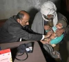 this photograph taken on january 8 2026 shows a quack doctor abdul waheed l trying to diagnose a minor in his unlicensed clinic on the outskirts of hyderabad photo afp