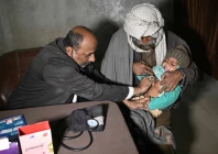 this photograph taken on january 8 2026 shows a quack doctor abdul waheed l trying to diagnose a minor in his unlicensed clinic on the outskirts of hyderabad photo afp