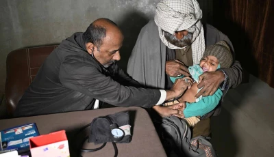 this photograph taken on january 8 2026 shows a quack doctor abdul waheed l trying to diagnose a minor in his unlicensed clinic on the outskirts of hyderabad photo afp