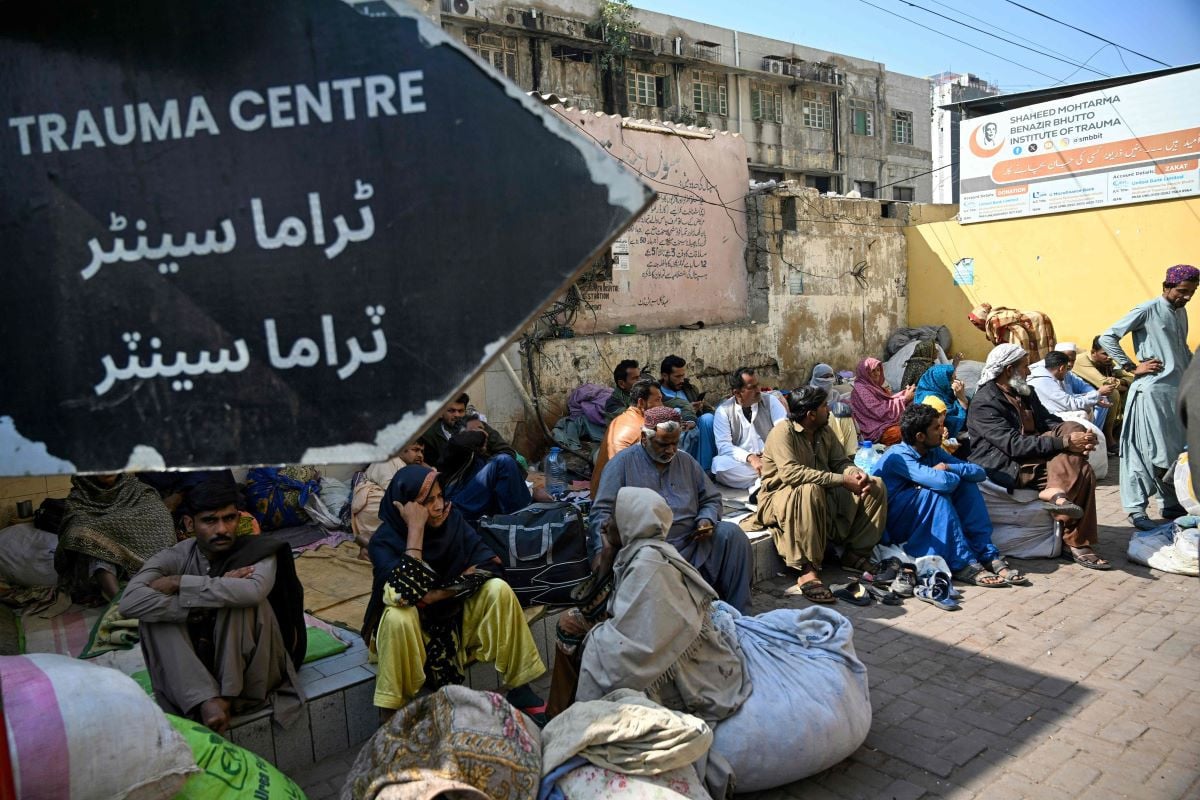 This photograph taken on January 14, 2026, shows patients awaiting treatment in the premises of a civil hospital in Karachi. PHOTO:AFP