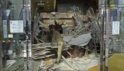 a worker cleans up inside a commercial facility in hachinohe in aomori prefecture northeastern japan december 9 2025 following a strong earthquake the previous night photo reuters