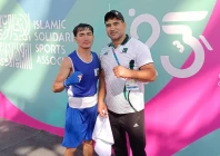 qudratullah confirmed second islamic solidarity games 2025 bronze medal for pakistan he poses with his coach nisar khan after the quarterfinal bout photo courtesy pbf