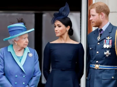 the queen breaks silence on meghan harry s explosive interview
