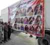 in the line of duty people gather near a vehicle portraying the images of individuals who lost their lives in the recent terrorist attacks in quetta photo afp