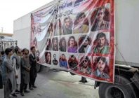 in the line of duty people gather near a vehicle portraying the images of individuals who lost their lives in the recent terrorist attacks in quetta photo afp