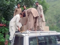 poverty s cruel homecoming people unload the coffin of a coal miner after the body arrived in k p s shangla photo express
