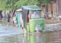 rickshaws pass through rainwater accumulated on makkah road in lahore after a downpour the rain lashed the city for two and a half hours photo app