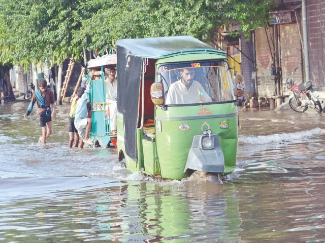 rickshaws pass through rainwater accumulated on makkah road in lahore after a downpour the rain lashed the city for two and a half hours photo app rickshaws pass through rainwater accumulated on makkah road in lahore after a downpour the rain lashed the city for two and a half hours photo app
