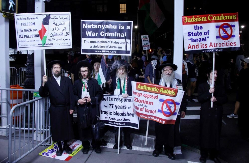 Members of the Jewish community participate in the 