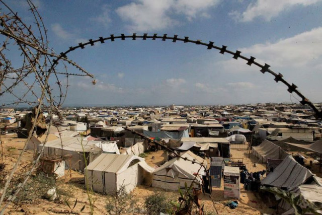 displaced palestinians who fled their houses due to israeli strikes shelter at a tent camp amid the ongoing conflict between israel and hamas in rafah in the southern gaza strip june 19 2024 photo reuters displaced palestinians who fled their houses due to israeli strikes shelter at a tent camp amid the ongoing conflict between israel and hamas in rafah in the southern gaza strip june 19 2024 photo reuters
