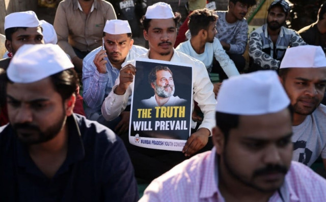 supporters of the youth congress party hold placards during a silent protest against the conviction of rahul gandhi president of india s main opposition congress party in a 2019 defamation case by a surat court on a street in mumbai india march 23 2023 reuters francis mascarenhas supporters of the youth congress party hold placards during a silent protest against the conviction of rahul gandhi president of india s main opposition congress party in a 2019 defamation case by a surat court on a street in mumbai india march 23 2023 reuters francis mascarenhas