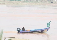 rising waters a civil defence official patrols the ravi river in a boat in lahore photo nni