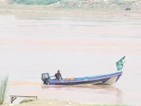 rising waters a civil defence official patrols the ravi river in a boat in lahore photo nni