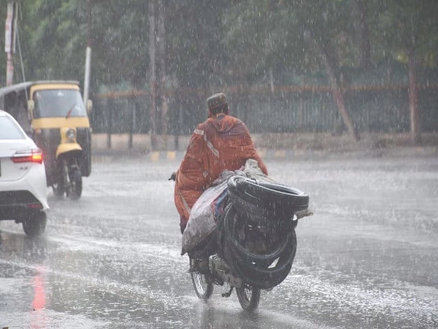 a motorcyclist makes his way through rain in balochistan s capital which faces a perennial shortage of water photo inp a motorcyclist makes his way through rain in balochistan s capital which faces a perennial shortage of water photo inp
