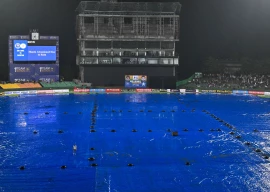 a general view shows the covered pitch after the second twenty20 international cricket match between pakistan and sri lanka was abandoned due to rain at the rangiri dambulla international stadium in dambulla on january 9 2026 photo afp