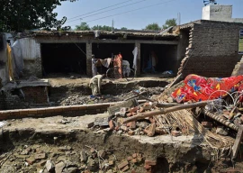 four killed nine injured in rains across k p