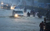 commuters struggle to move forward in a flooded street after heavy monsoon rains in karachi on august 27 2020 photo anadolu agency file commuters struggle to move forward in a flooded street after heavy monsoon rains in karachi on august 27 2020 photo anadolu agency file