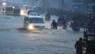 commuters struggle to move forward in a flooded street after heavy monsoon rains in karachi on august 27 2020 photo anadolu agency file